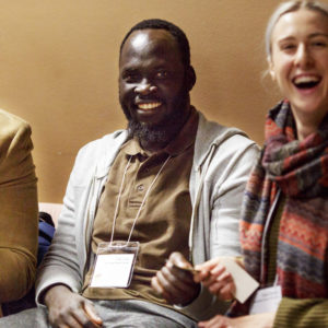 tables with participants at conference event