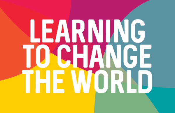 Rainbow colours with text: "learning to change the world"