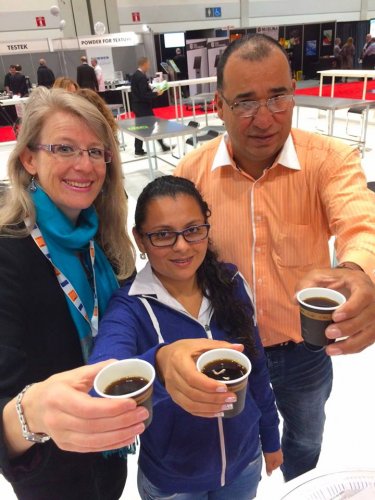 Philippa testing coffee with Colombian producers in Toronto
