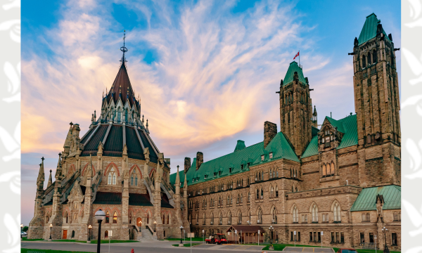 Image of Parliament building in Ottawa under sunset-coloured clouds