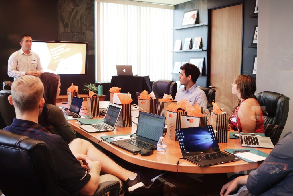 What is a worker cooperative promo image of people at a board table.