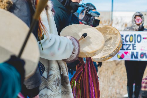 Image of Indigenous people playing drums at solidarity rally for Wet'suwet'en
